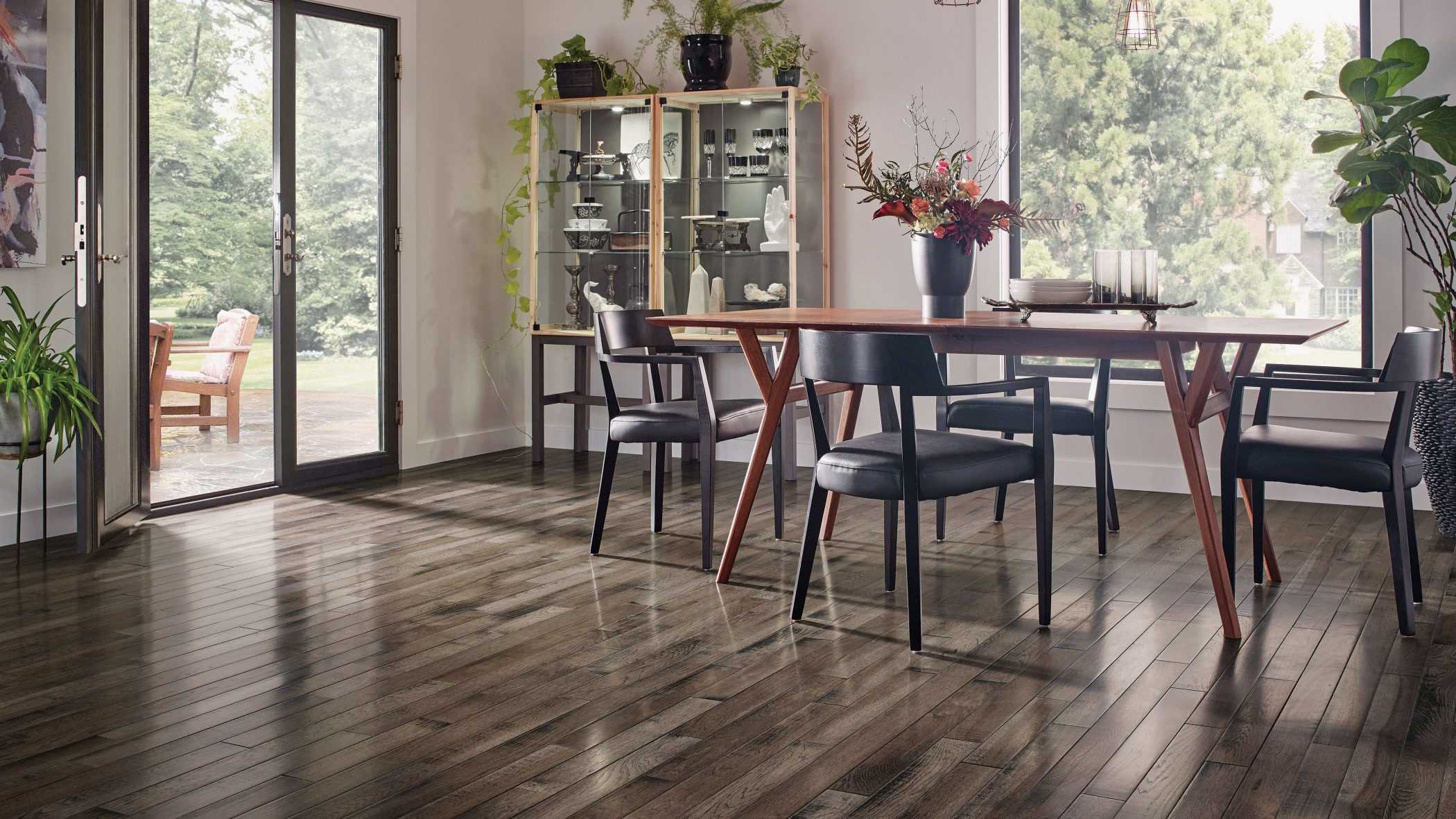 dining room area with French doors open to the patio featuring hardwood flooring from Hartco
